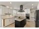 Stylish kitchen boasting white cabinets, black accents, stainless steel appliances, and a kitchen island at 2366 E Shea Blvd, Phoenix, AZ 85028