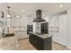 Modern kitchen featuring granite countertops, stainless steel appliances, island cooktop, and white cabinetry at 2366 E Shea Blvd, Phoenix, AZ 85028