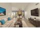 Open-concept living room with fireplace, vaulted ceilings, and hardwood floors at 2366 E Shea Blvd, Phoenix, AZ 85028