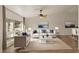 Bright living room with large window, modern furnishings, and neutral color palette at 2366 E Shea Blvd, Phoenix, AZ 85028