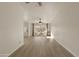 Bright living room with light wood flooring, white walls, and large windows overlooking the neighborhood at 2366 E Shea Blvd, Phoenix, AZ 85028