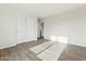 Neutral bedroom featuring a large closet with white sliding doors and wood-look flooring at 24938 S 190Th Dr, Buckeye, AZ 85326