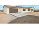 View of the home's garage and new concrete driveway at 24938 S 190Th Dr, Buckeye, AZ 85326
