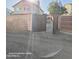 View of a backyard gate that opens to a manicured lawn and a home's back patio at 2825 N Villas N Ln, Chandler, AZ 85224