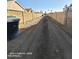 View down a dirt path flanked by block walls in a backyard at 2825 N Villas N Ln, Chandler, AZ 85224