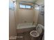 Bathroom features a shower-tub combo, toilet, and a window letting in natural light at 2825 N Villas N Ln, Chandler, AZ 85224