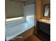 Bathroom featuring a bathtub with shower and a vanity with sink and storage at 2825 N Villas N Ln, Chandler, AZ 85224