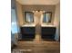 Double vanity bathroom offers two sinks with mirrors, plenty of counter space, and storage at 2825 N Villas N Ln, Chandler, AZ 85224