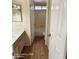 Bathroom showing a sink with wood cabinets and a toilet with a shower-over-tub at 2825 N Villas N Ln, Chandler, AZ 85224