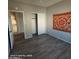 This bedroom features vinyl plank flooring, neutral walls, and a closet for storage at 2825 N Villas N Ln, Chandler, AZ 85224