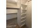 Spacious walk-in closet with built in shelving and ample storage space at 2825 N Villas N Ln, Chandler, AZ 85224
