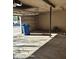 Empty garage featuring a large open overhead door at 2825 N Villas N Ln, Chandler, AZ 85224