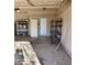 Spacious garage with a metal shelving unit and two utility doors at 2825 N Villas N Ln, Chandler, AZ 85224
