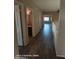 Hallway with vinyl floors connects several rooms in the home, including a bathroom at 2825 N Villas N Ln, Chandler, AZ 85224