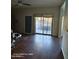 Spacious open living room with wood floors and sliding glass doors leading to the backyard at 2825 N Villas N Ln, Chandler, AZ 85224