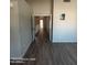 An open-concept living room with wood floors and natural light at 2825 N Villas N Ln, Chandler, AZ 85224