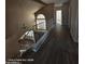 Staircase with wood flooring and metal railing at 2825 N Villas N Ln, Chandler, AZ 85224