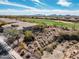Scenic aerial view of property next to golf course, surrounded by desert landscape at 3045 W Feather Sound Dr, Anthem, AZ 85086