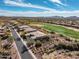 Stunning aerial view of home nestled near a golf course, offering scenic mountain views at 3045 W Feather Sound Dr, Anthem, AZ 85086