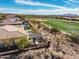 Aerial shot showcasing a backyard with a pool, patio, and manicured landscaping at 3045 W Feather Sound Dr, Anthem, AZ 85086