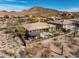 Outdoor oasis with a pergola-covered patio, pool, and lush landscaping in a desert setting at 3045 W Feather Sound Dr, Anthem, AZ 85086