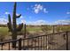 Scenic backyard view showcasing a lush golf course, desert landscape, and clear blue skies at 3045 W Feather Sound Dr, Anthem, AZ 85086