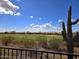Beautiful backyard view featuring a well-maintained golf course and desert vegetation at 3045 W Feather Sound Dr, Anthem, AZ 85086