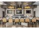Upscale bar area with modern lighting, comfortable seating, and multiple TVs for entertainment at 3045 W Feather Sound Dr, Anthem, AZ 85086