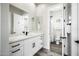 Bright bathroom with white vanity, modern fixtures, and an open doorway to the shower and toilet at 3045 W Feather Sound Dr, Anthem, AZ 85086