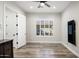 Neutral bedroom with wood-look floors, ceiling fan, and plenty of natural light at 3045 W Feather Sound Dr, Anthem, AZ 85086