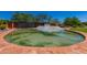 Community entrance with water feature, lush landscape and clear blue sky at Anthem Country Club at 3045 W Feather Sound Dr, Anthem, AZ 85086