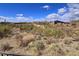 Expansive community view featuring desert landscape, homes and sunny skies at 3045 W Feather Sound Dr, Anthem, AZ 85086