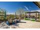 Outdoor seating area under a pergola featuring a grill and outdoor dining set at 3045 W Feather Sound Dr, Anthem, AZ 85086