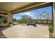 Covered patio with desert landscaping featuring comfortable seating and a serene outdoor view at 3045 W Feather Sound Dr, Anthem, AZ 85086