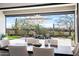 Elegant dining area with desert views and stylish light fixture next to a covered patio with seating at 3045 W Feather Sound Dr, Anthem, AZ 85086