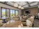 Cozy dining area featuring comfortable seating and a large screen television for entertainment at 3045 W Feather Sound Dr, Anthem, AZ 85086