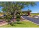 Community entrance with lush landscaping, desert foliage, and a well-paved entry at 3045 W Feather Sound Dr, Anthem, AZ 85086