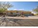 Charming home exterior with desert landscaping, stone accents, and a welcoming entrance at 3045 W Feather Sound Dr, Anthem, AZ 85086