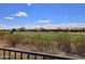 View of the well-manicured golf course with desert landscaping in front of beautiful houses on a sunny day at 3045 W Feather Sound Dr, Anthem, AZ 85086
