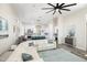 Open-concept living and kitchen area with modern accents, stylish furniture, and ample natural light at 3045 W Feather Sound Dr, Anthem, AZ 85086