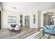 Open-concept living and dining area with built in shelving and access to the patio at 3045 W Feather Sound Dr, Anthem, AZ 85086