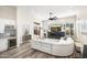 Spacious living room with fireplace and large windows, providing ample natural light and stunning views at 3045 W Feather Sound Dr, Anthem, AZ 85086