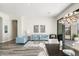 Bright and spacious living area adjacent to dining room with a view to outdoor patio at 3045 W Feather Sound Dr, Anthem, AZ 85086