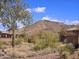 Stunning desert mountain view, complemented by lush, green landscaping at 3045 W Feather Sound Dr, Anthem, AZ 85086