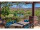 Outdoor seating area offering beautiful views of the lake and mountains, perfect for relaxation at 3045 W Feather Sound Dr, Anthem, AZ 85086