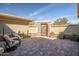 Enclosed patio featuring a stone accent wall, stylish pavers, and plenty of seating space at 3045 W Feather Sound Dr, Anthem, AZ 85086