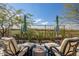 Inviting patio featuring lounge chairs, umbrellas, and serene views of the green golf course at 3045 W Feather Sound Dr, Anthem, AZ 85086