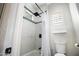 Clean shower with a modern showerhead, tiled walls, and a window for natural light at 3045 W Feather Sound Dr, Anthem, AZ 85086