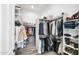 Well-organized walk-in closet with ample hanging space, shelving for shoes, and other storage solutions at 3045 W Feather Sound Dr, Anthem, AZ 85086