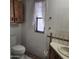 Functional bathroom design with a toilet, vanity, and a window with natural light at 3160 E Main St # 72, Mesa, AZ 85213